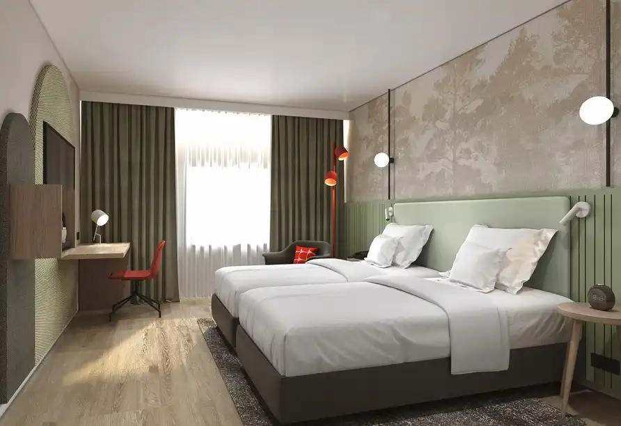 Ein modernes und stilvolles Zimmer im FORA Hotel Hannover by Mercure. Das Zimmer verfügt über zwei Betten mit weißen